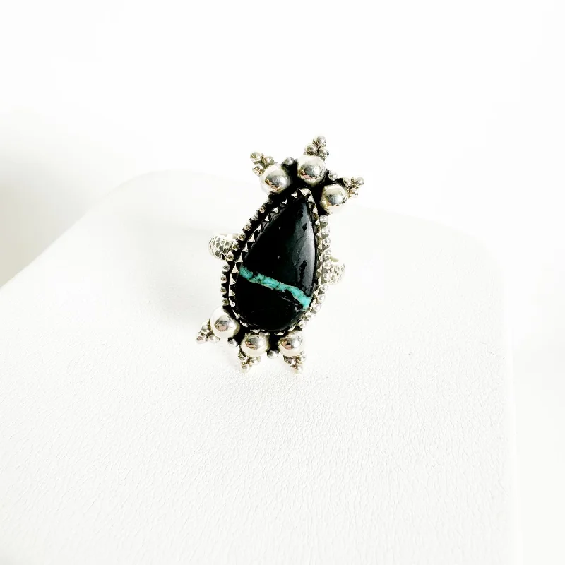 Elevate Your Outfit With Discounted Statement Jewelry Ribbon Blackjack Ring